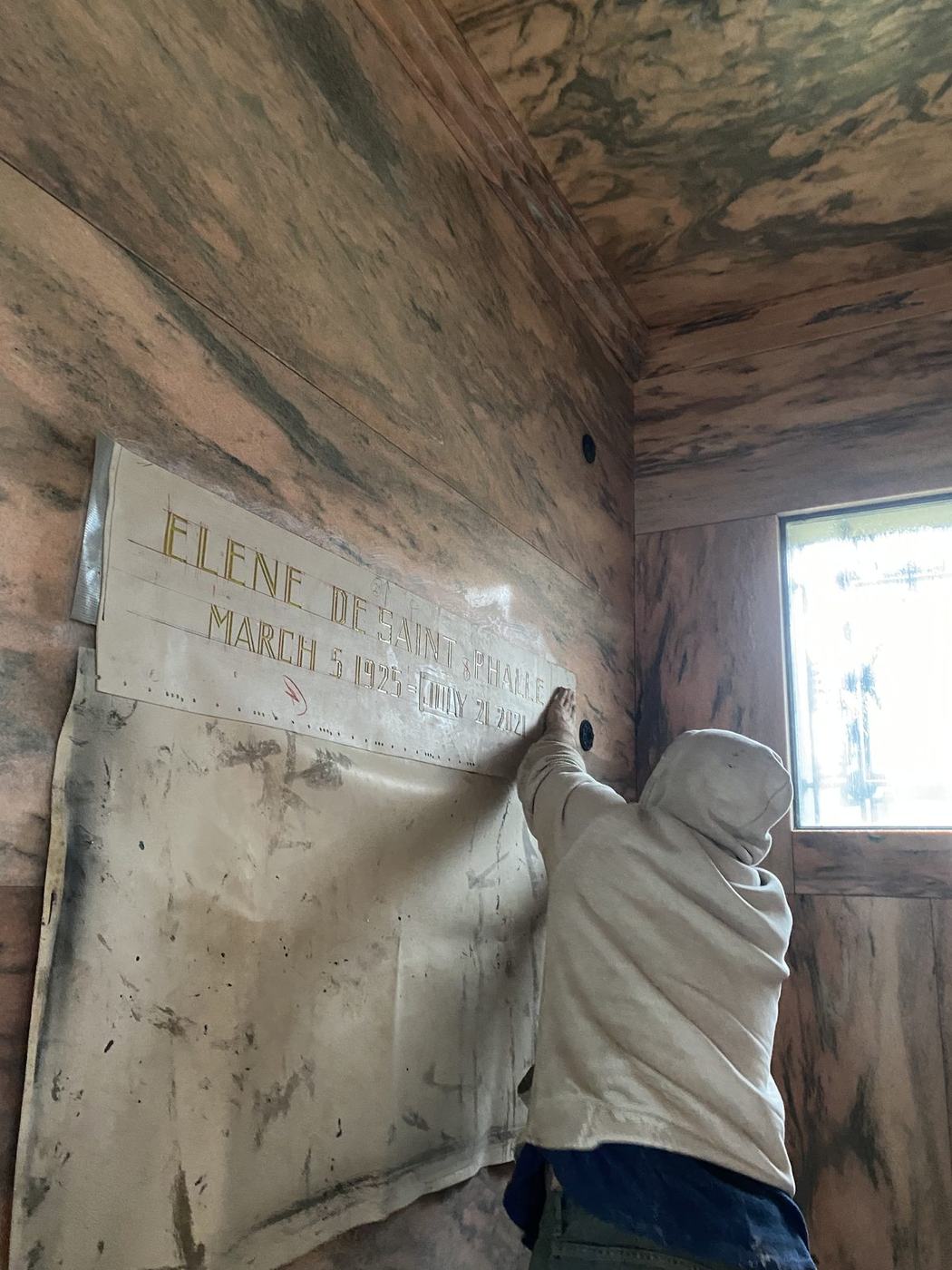 Mausoleum crypt stencil application - Monument Inscriptions Engraver applying a lettering stencil to a marble crypt front inside a mausoleum